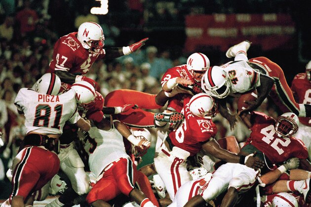 University of Miami fullback Cleveland Gary (43) dives over the top of the Nebraska defensive line during action in the 55th Orange Bowl Classic in Miami on Jan. 2, 1989. Nebraska stoped Gary after a short gain.(AP Photo/Steve Murphy)