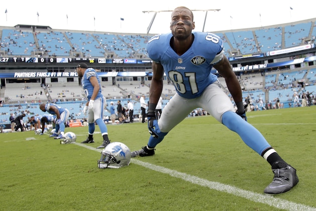 Detroit Lions' Calvin Johnson (81) warms up before an NFL football game against the Carolina Panthers in Charlotte, N.C., Sunday Sept. 14, 2014. The Panthers won 24-7. (AP Photo/Bob Leverone)