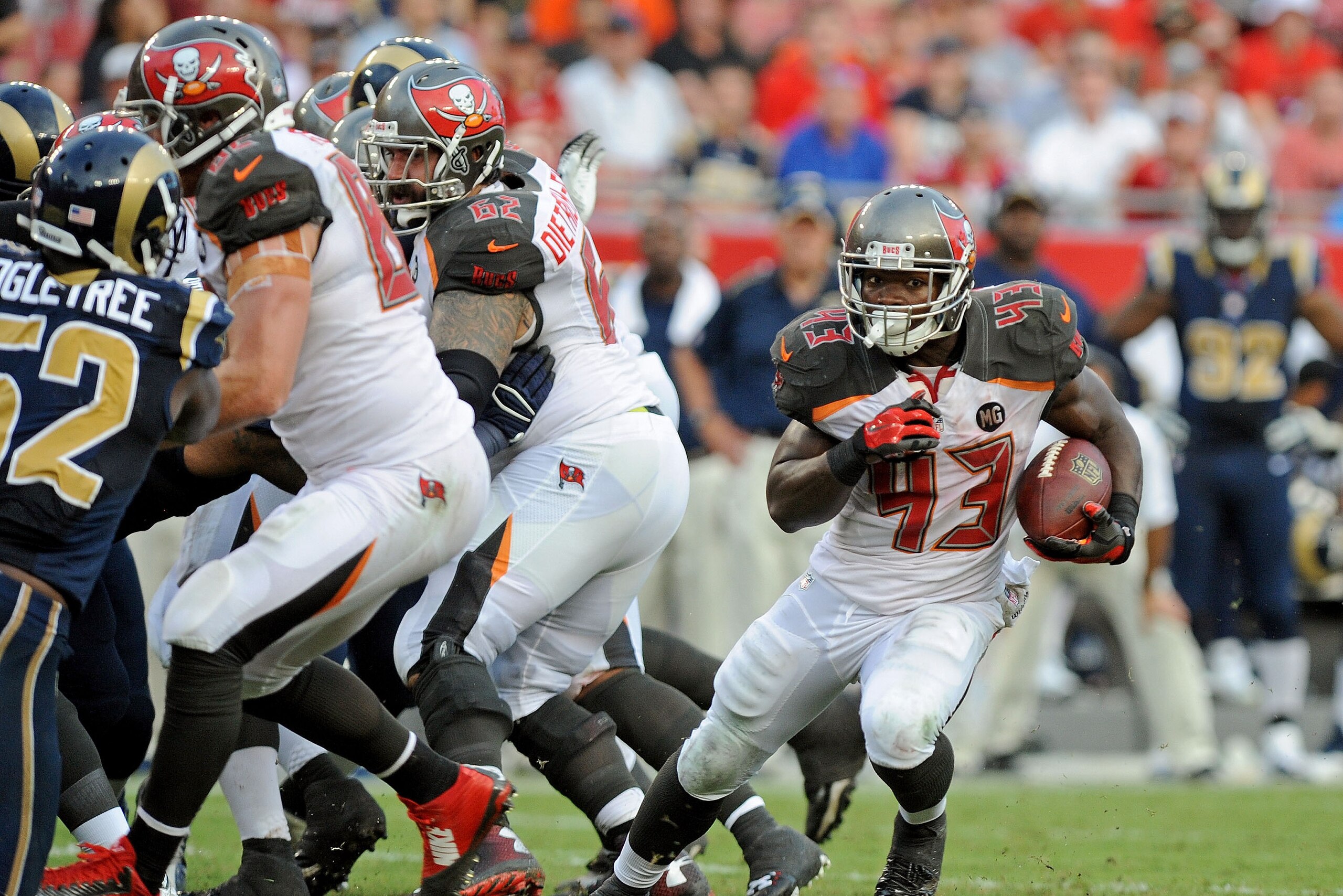 TAMPA, FL - SEPTEMBER 14: Bobby Rainey #43 of the Tampa Bay Buccaneers rushes during the second quarter of the game against the St. Louis Rams at Raymond James Stadium on September 14, 2014 in Tampa, Florida.  (Photo by Cliff McBride/Getty Images)