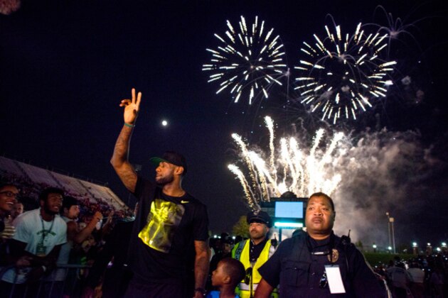 AKRON, OH - AUGUST 08: LeBron James waves to his fans in the city of Akron after taking the stage during his Welcome Home Ceremony at Infocision Stadium at the University of Akron on August 8, 2014 in Akron, Ohio. (Photo by Ty Wright/Getty Images)