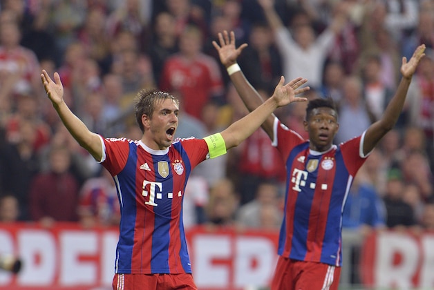 Bayern's Philipp Lahm, left, and Bayern's David Alaba gesture during the Champions League group E soccer match between Bayern Munich and Manchester City in Munich, Germany, Wednesday Sept.17,2014. (AP Photo/Kerstin Joensson)