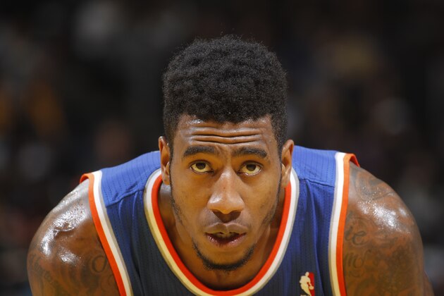 OAKLAND, CA - MARCH 30: Iman Shumpert #21 of the New York Knicks in a game against the Golden State Warriors on March 30, 2014 at Oracle Arena in Oakland, California. NOTE TO USER: User expressly acknowledges and agrees that, by downloading and or using this photograph, user is consenting to the terms and conditions of Getty Images License Agreement. Mandatory Copyright Notice: Copyright 2014 NBAE (Photo by Rocky Widner/NBAE via Getty Images)