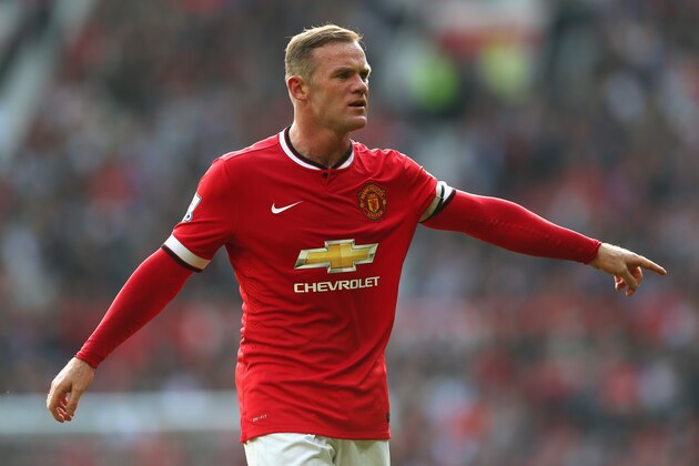 MANCHESTER, ENGLAND - SEPTEMBER 14:  Wayne Rooney of Manchester United gestures during the Barclays Premier League match between Manchester United and Queens Park Rangers at Old Trafford on September 14, 2014 in Manchester, England.  (Photo by Alex Livesey/Getty Images)