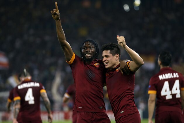 Roma's Gervinho, left, celebrates with his teammate Juan Manuel Arevalos Iturbe after scoring his side's second goal during a Champions League, Group E soccer match between Roma and CSKA, at the Olympic stadium, in Rome, Wednesday, Sept. 17, 2014. (AP Photo/Alessandra Tarantino)