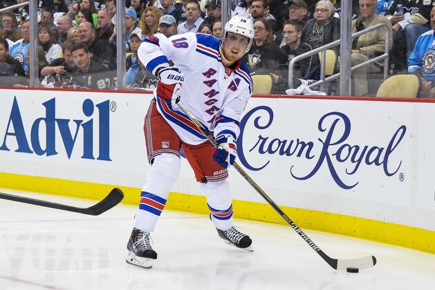 PITTSBURGH, PA - MAY 4:  Marc Staal #18 of the New York Rangers skates with the puck against the Pittsburgh Penguins in Game Two of the Second Round of the 2014 NHL Stanley Cup Playoffs on May 4, 2014 at CONSOL Energy Center in Pittsburgh, Pennsylvania.  (Photo by Jamie Sabau/Getty Images)