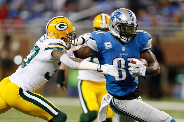 DETROIT, MI - NOVEMBER 28: Calvin Johnson #81 of the Detroit Lions tries to get around the tackle of Sam Shields #37 of the Green Bay Packers during the first quarter at Ford Field on November 28, 2013 in Detroit, Michigan. (Photo by Gregory Shamus/Getty Images)