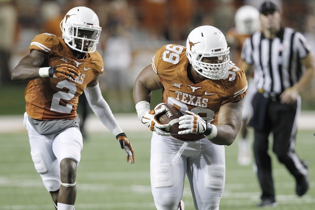 AUSTIN, TX - SEPTEMBER 6:  Desmond Jackson #99 of the Texas Longhorns returns a fumble for a few yards against the BYU Cougars on September 6, 2014 at Darrell K Royal-Texas Memorial Stadium in Austin, Texas. (Photo by Chris Covatta/Getty Images)