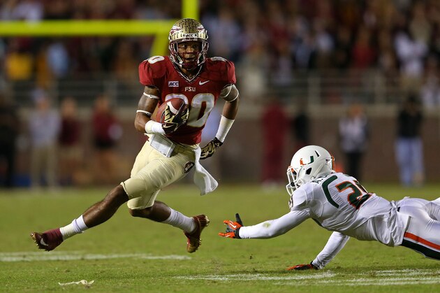 TALLAHASSEE, FL - NOVEMBER 02: Rashad Greene #80 of the Florida State Seminoles runs after a catch during a game against the Miami Hurricanes at Doak Campbell Stadium on November 2, 2013 in Tallahassee, Florida.  (Photo by Mike Ehrmann/Getty Images)