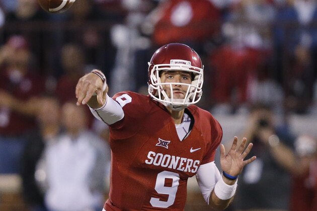 Oklahoma quarterback Trevor Knight (9) throws during an NCAA college football game between Tennessee and Oklahoma in Norman, Okla., Saturday, Sept. 13, 2014. (AP Photo/Sue Ogrocki)