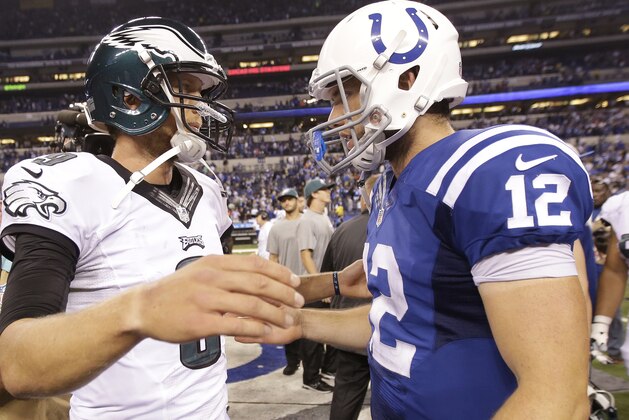 Philadelphia Eagles quarterback Nick Foles (9) is congratulated by Indianapolis Colts quarterback Andrew Luck (12) following an NFL football game Monday, Sept. 15, 2014, in Indianapolis. Philadelphia defeated Indianapolis 30-27. (AP Photo/AJ Mast)