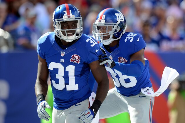 EAST RUTHERFORD, NJ - SEPTEMBER 14: Cornerback Zack Bowman #31 celebrates with cornerback Trumaine McBride #38 of the New York Giants against the Arizona Cardinals during a game at MetLife Stadium on September 14, 2014 in East Rutherford, New Jersey.  (Photo by Ron Antonelli/Getty Images)