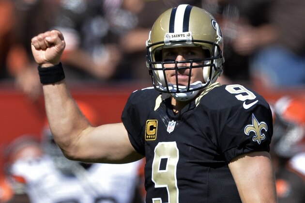 New Orleans Saints quarterback Drew Brees pumps his fist after throwing a touchdown pass against the Cleveland Browns in the third quarter of an NFL football game Sunday, Sept. 14, 2014, in Cleveland. (AP Photo/David Richard) New Orleans Saints quarterback Drew Brees pumps his fist after throwing a touchdown pass against the Cleveland Browns in the third quarter of an NFL football game Sunday, Sept. 14, 2014, in Cleveland. (AP Photo/David Richard)