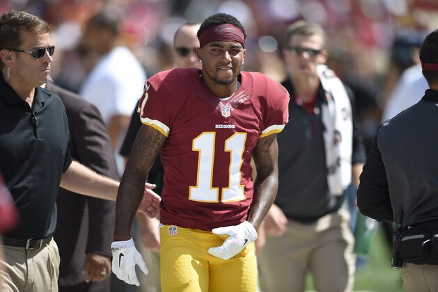 Washington Redskins wide receiver DeSean Jackson (11) walks after being injured during the first half of an NFL football game against the Jacksonville Jaguars, Sunday, Sept. 14, 2014, in Landover, Md. (AP Photo/Nick Wass)