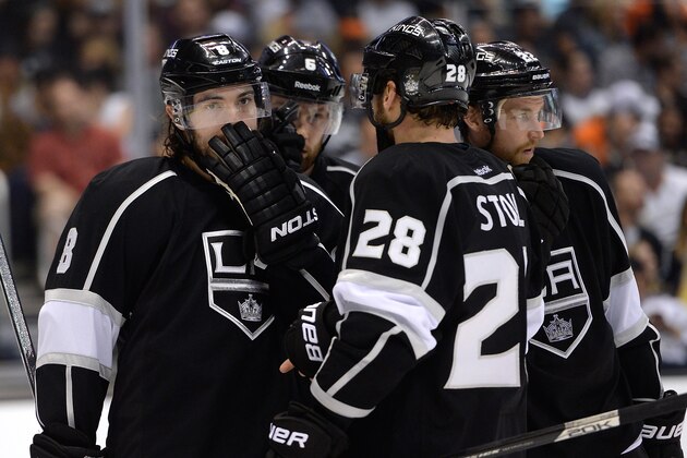LOS ANGELES, CA - MAY 14:  Drew Doughty #8 of the Los Angeles Kings discusses play with Jarret Stoll #28, Jake Muzzin #6 and Trevor Lewis #22 during the third period against the Anaheim Ducks in Game Six of the Second Round of the 2014 NHL Stanley Cup Playoffs at Staples Center on May 14, 2014 in Los Angeles, California.  (Photo by Harry How/Getty Images)