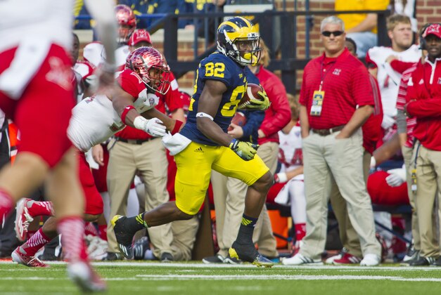 Michigan wide receiver Amara Darboh (82) rushes up the sideline after a reception in the second quarter of an NCAA college football game against Miami (Ohio) in Ann Arbor, Mich., Saturday, Sept. 13, 2014. (AP Photo/Tony Ding) Michigan wide receiver Amara Darboh (82) rushes up the sideline after a reception in the second quarter of an NCAA college football game against Miami (Ohio) in Ann Arbor, Mich., Saturday, Sept. 13, 2014. (AP Photo/Tony Ding)