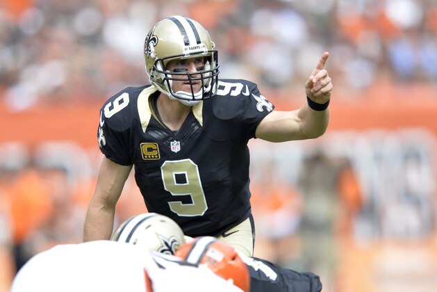 New Orleans Saints quarterback Drew Brees stands at the line of scrimmage during an NFL football game against the Cleveland Browns Sunday, Sept. 14, 2014, in Cleveland. Cleveland won 26-24. (AP Photo/David Richard)
