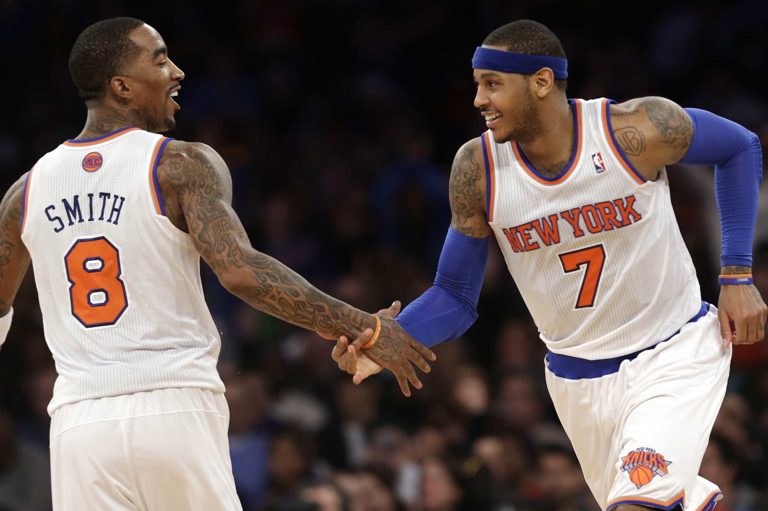 New York Knicks guard J.R. Smith (8), who scored 18 points, congratulates forward Carmelo Anthony (7) after Anthony hit a three-point shot in the second half of an NBA basketball game at Madison Square Garden in New York, Sunday, Jan. 27, 2013. Anthony scored 42 points, including nine three-point shots as the Knicks defeated the Hawks 106-104. (AP Photo/Kathy Willens) New York Knicks guard J.R. Smith (8), who scored 18 points, congratulates forward Carmelo Anthony (7) after Anthony hit a three-point shot in the second half of an NBA basketball game at Madison Square Garden in New York, Sunday, Jan. 27, 2013. Anthony scored 42 points, including nine three-point shots as the Knicks defeated the Hawks 106-104. (AP Photo/Kathy Willens)