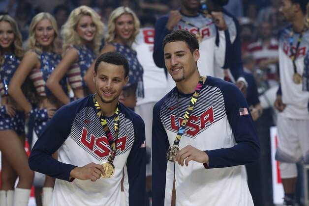 United States' Stephen Curry, left, and Klay Thompson celebrate after wining the final World Basketball match against Serbia at the Palacio de los Deportes stadium in Madrid, Spain, Sunday, Sept. 14, 2014. (AP Photo/Daniel Ochoa de Olza)
