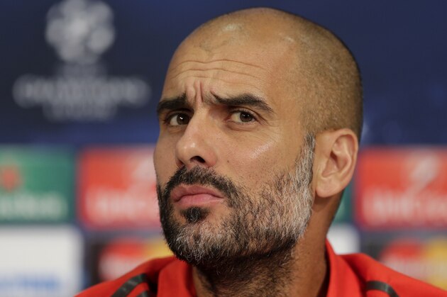 Bayern's head coach Pep Guardiola attends a press conference ahead of Wednesday's Champions League group E soccer match between FC Bayern Munich and Manchester City, in Munich, southern Germany, Tuesday, Sept. 16, 2014. (AP Photo/Matthias Schrader)