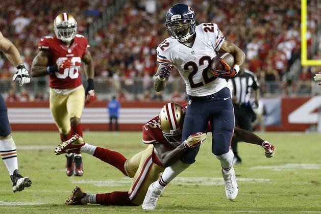 Chicago Bears running back Matt Forte (22) runs as San Francisco 49ers strong safety Jimmie Ward (25) tries to tackle him during an NFL football game in Santa Clara, Calif., Sunday, Sept. 14, 2014. (AP Photo/Tony Avelar)