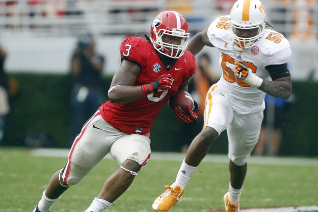 FILE - In this Sept. 29, 2012, file photo, Tennessee linebacker Curt Maggitt (56) chases Georgia running back Todd Gurley (3) during an NCAA college football game in Athens, Ga. Maggitt is cautiously optimistic that he will be ready for the start of the season as he comes back from a torn anterior cruciate ligament in his right knee. (AP Photo/John Bazemore, File)