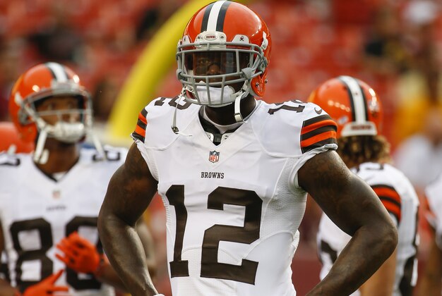Cleveland Browns wide receiver Josh Gordon (12) warms up before an NFL preseason football game against the Washington Redskins on Monday, Aug. 18, 2014, in Landover, Md. (AP Photo/Evan Vucci)