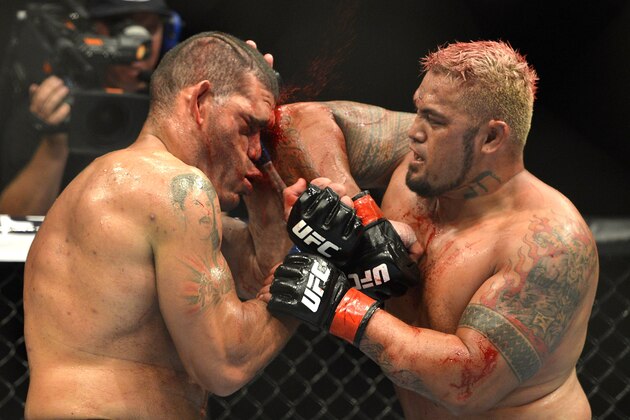 BRISBANE, AUSTRALIA - DECEMBER 07: Mark Hunt connects with an elbow during the UFC Brisbane bout between Mark Hunt and Antonio 'Big Foot' Silva of Brazil at the Brisbane Entertainment Centre on December 7, 2013 in Brisbane, Australia. (Photo by Bradley Kanaris/Getty Images) BRISBANE, AUSTRALIA - DECEMBER 07: Mark Hunt connects with an elbow during the UFC Brisbane bout between Mark Hunt and Antonio 'Big Foot' Silva of Brazil at the Brisbane Entertainment Centre on December 7, 2013 in Brisbane, Australia. (Photo by Bradley Kanaris/Getty Images)