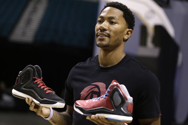 LAS VEGAS, NV - JULY 27: Derrick Rose of the Chicago Bulls shows off the new adidas D Rose 5 Boost during the Adidas BOOST Basketball Launch inside the MGM Grand Garden Arena in Las Vegas on July 27, 2014 in Las Vegas, Nevada. (Photo by Isaac Brekken/Getty Images for adidas)