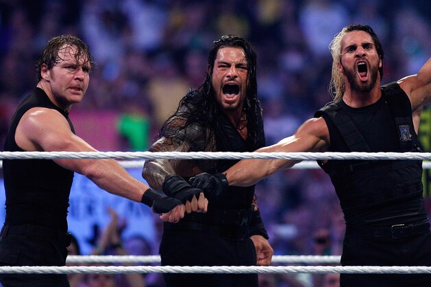 The Shield reacts after their win during Wrestlemania XXX at the Mercedes-Benz Super Dome in New Orleans on Sunday, April 6, 2014. (Jonathan Bachman/AP Images for WWE)