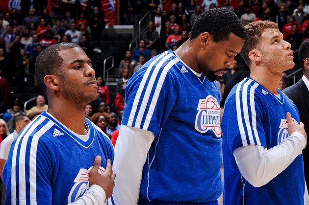 LOS ANGELES, CA - JANUARY 19: Los Angeles Clippers players, from left, Chris Paul #3, DeAndre Jordan #6 and Blake Griffin #32 listen to the National Anthem before playing against the Washington Wizards at Staples Center on January 19, 2013 in Los Angeles, California. NOTE TO USER: User expressly acknowledges and agrees that, by downloading and/or using this photograph, user is consenting to the terms and conditions of the Getty Images License Agreement. Mandatory Copyright Notice: Copyright 2013 NBAE (Photo by Andrew D. Bernstein/NBAE via Getty Images)