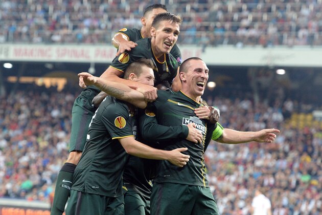 Celtic's players celebrate after scoring during the Europa League group D soccer match between FC Salzburg and Celtic FC in the Arena in Salzburg, Austria, on Thursday, Sep. 18, 2014. (AP Photo/Kerstin Joensson)