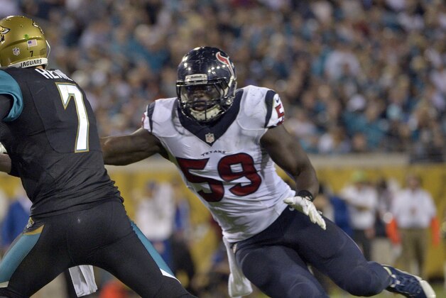Jacksonville Jaguars quarterback Chad Henne (7) eludes Houston Texans outside linebacker Whitney Mercilus (59) during the third quarter of an NFL football game Thursday, Dec. 5, 2013, in Jacksonville, Fla. (AP Photo/Phelan M. Ebenhack)