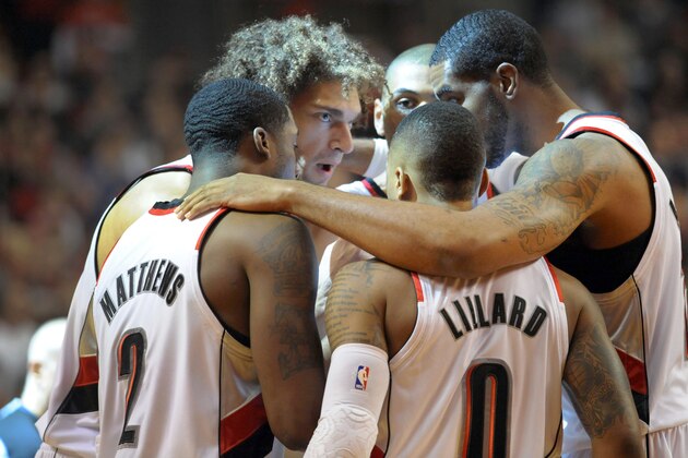 PORTLAND, OR - APRIL  25: The Portland Trail Blazers starting five, Wesley Matthews #2, Damian Lillard #0, LaMarcus Aldridge #12, Nicolas Batum #88 and Robin Lopez #42 huddle before Game Three of the Western Conference Quarterfinals during the 2014 NBA Playoffs at the Moda Center on April 25, 2014 in Portland, Oregon. NOTE TO USER: User expressly acknowledges and agrees that, by downloading and or using this photograph, User is consenting to the terms and conditions of the Getty Images License Agreement. (Photo by Steve Dykes/Getty Images)
