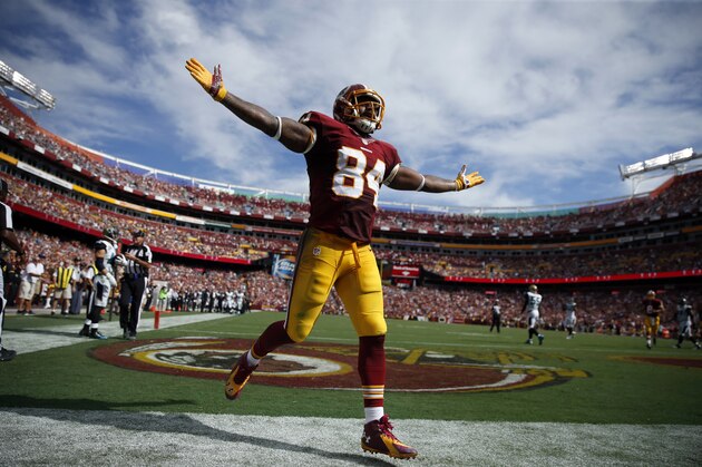 Washington Redskins tight end Niles Paul (84) celebrates his touchdown during the second half of an NFL football game against the Jacksonville Jaguars, Sunday, Sept. 14, 2014, in Landover, Md. (AP Photo/Evan Vucci)
