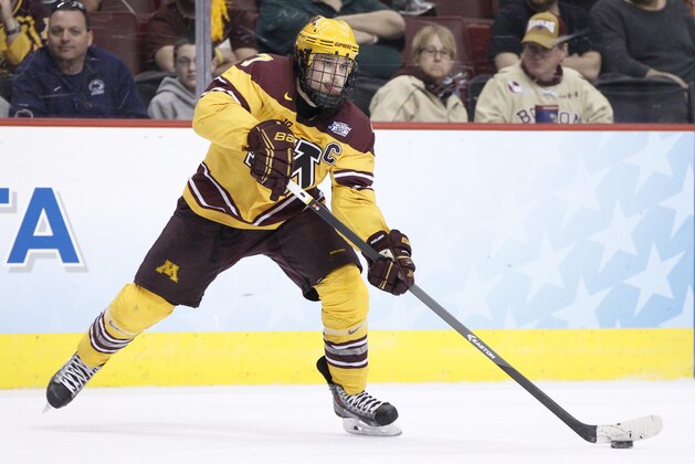 Minnesota's Kyle Rau in action during the second period of an NCAA men's college hockey Frozen Four tournament game against North Dakota, Thursday, April 10, 2014, in Philadelphia. Minnesota won 2-1. (AP Photo/Chris Szagola)