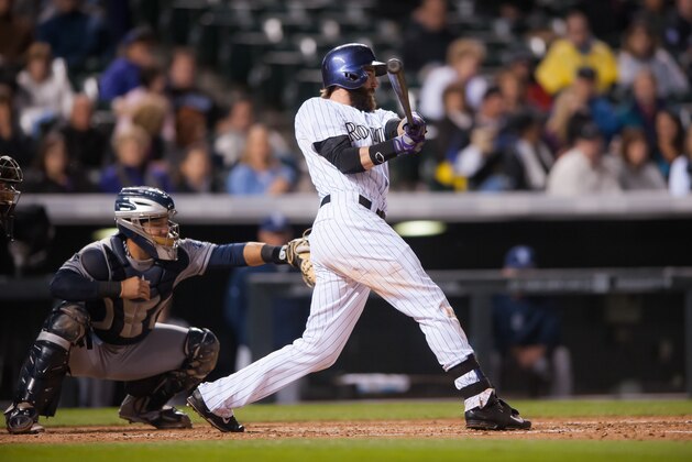DENVER, CO - SEPTEMBER 05:  Charlie Blackmon #19 of the Colorado Rockies hits a fifth inning RBI single against the San Diego Padres during a game at Coors Field on September 5, 2014 in Denver, Colorado.  (Photo by Dustin Bradford/Getty Images)