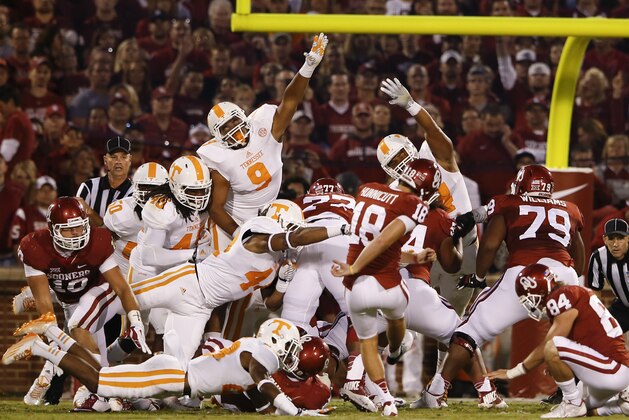 Sep 13, 2014; Norman, OK, USA; Oklahoma Sooners place kicker Michael Hunnicutt (18) kicks during the game against the Tennessee Volunteers at Gaylord Family - Oklahoma Memorial Stadium. Mandatory Credit: Kevin Jairaj-USA TODAY Sports