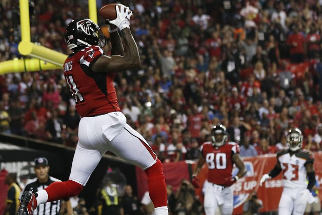 Atlanta Falcons wide receiver Julio Jones (11) makes a touch-down catch against the Tampa Bay Buccaneers during the first half of an NFL football game, Thursday, Sept. 18, 2014, in Atlanta. (AP Photo/John Bazemore)