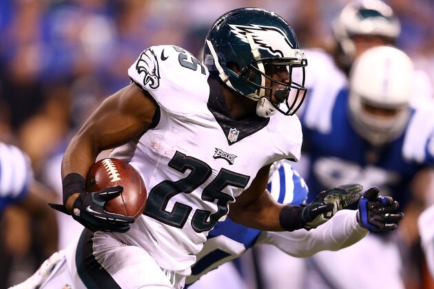 INDIANAPOLIS, IN - SEPTEMBER 15:  Running back LeSean McCoy #25 of the Philadelphia Eagles carries the ball as free safety LaRon Landry #30 of the Indianapolis Colts defends during a game at Lucas Oil Stadium on September 15, 2014 in Indianapolis, Indiana.  (Photo by Andy Lyons/Getty Images)