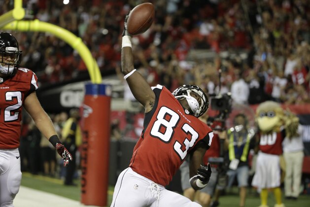 Atlanta Falcons wide receiver Harry Douglas (83) celebrates his touchdown against the Tampa Bay Buccaneers during the first half of an NFL football game, Thursday, Sept. 18, 2014, in Atlanta. (AP Photo/David Goldman)