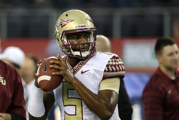 Florida State quarterback Jameis Winston (5) throws a pass during warm ups before an NCAA college football game against Oklahoma State, Saturday, Aug. 30, 2014, in Arlington, Texas. (AP Photo/Tony Gutierrez)