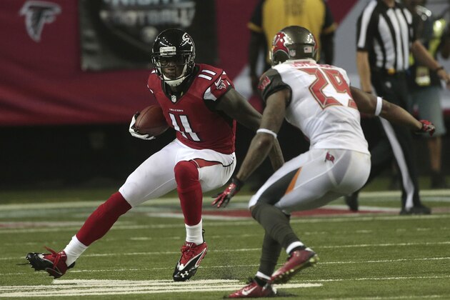 Atlanta Falcons wide receiver Julio Jones (11) moves against Tampa Bay Buccaneers cornerback Leonard Johnson (29) during the first half of an NFL football game, Thursday, Sept. 18, 2014, in Atlanta. (AP Photo/John Bazemore)