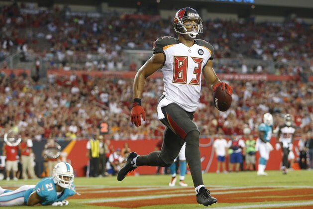 Tampa Bay Buccaneers wide receiver Vincent Jackson (83) scores on a seven-yard touchdown reception from quarterback Josh McCown during the second quarter of an NFL preseason football game Saturday, Aug. 16, 2014, in Tampa, Fla. (AP Photo/Brian Blanco)
