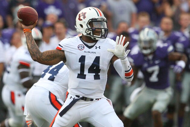 Sep 18, 2014; Manhattan, KS, USA; Auburn Tigers quarterback Nick Marshall (14) drops back to pass during first-half action against the Kansas State Wildcats at Bill Snyder Family Stadium. Mandatory Credit: Scott Sewell-USA TODAY Sports