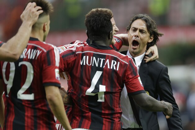 AC Milan midfielder Sulley Muntari, of Ghana, back to camera, celebrates with AC Milan coach Filippo Inzaghi after scoring his side's second goal during a Serie A soccer match between AC Milan and Lazio, at the San Siro stadium in Milan, Italy, Sunday, Aug. 31, 2014. (AP Photo/Luca Bruno) AC Milan midfielder Sulley Muntari, of Ghana, back to camera, celebrates with AC Milan coach Filippo Inzaghi after scoring his side's second goal during a Serie A soccer match between AC Milan and Lazio, at the San Siro stadium in Milan, Italy, Sunday, Aug. 31, 2014. (AP Photo/Luca Bruno)