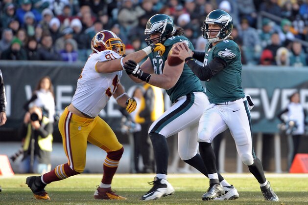 Dec 23, 2012; Philadelphia, PA, USA; Philadelphia Eagles quarterback Nick Foles (9) is pressured by Washington Redskins outside linebacker Ryan Kerrigan (91) during the second quarter at Lincoln Financial Field.  Mandatory Credit: Eric Hartline-USA TODAY Sports