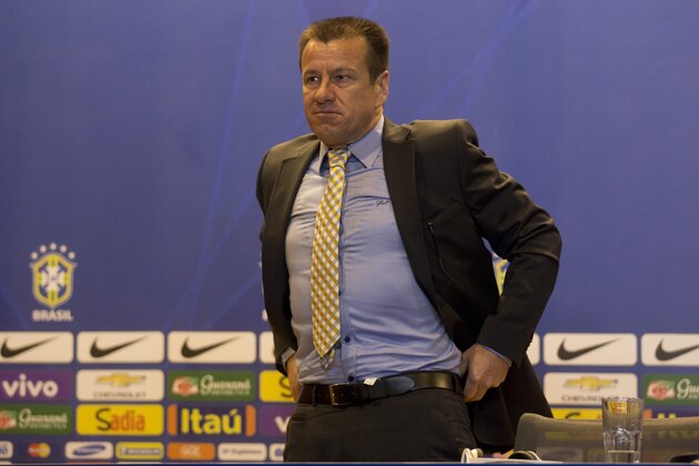 Brazil's soccer coach Dunga prepares to leave after a press conference in Rio de Janeiro, Brazil, Wednesday, Sept. 17, 2014.  Dunga summoned players for upcoming friendly games with Argentina and Japan. (AP Photo/Silvia Izquierdo)