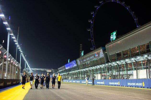 SINGAPORE - SEPTEMBER 18:  Jean-Eric Vergne of Toro Rosso and France ahead of the Singapore F1 Grand Prix at Marina Bay Street Circuit on September 18, 2014 in Singapore.  (Photo by Peter Fox/Getty Images)