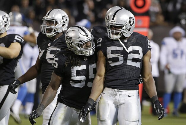 Oakland Raiders outside linebacker Sio Moore (55) and outside linebacker Khalil Mack (52) against the Detroit Lions during an NFL preseason football game in Oakland, Calif., Friday, Aug. 15, 2014. (AP Photo/Marcio Jose Sanchez)
