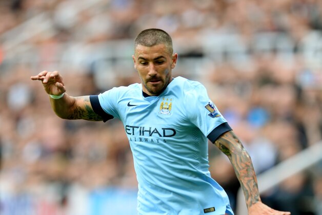 NEWCASTLE UPON TYNE, ENGLAND - AUGUST 17:  Aeksandr Kolarov of Manchester City runs with the ball during the Barclays Premier League match between Newcastle United and Manchester City at St James' Park on August 17, 2014 in Newcastle upon Tyne, England.  (Photo by Jamie McDonald/Getty Images)